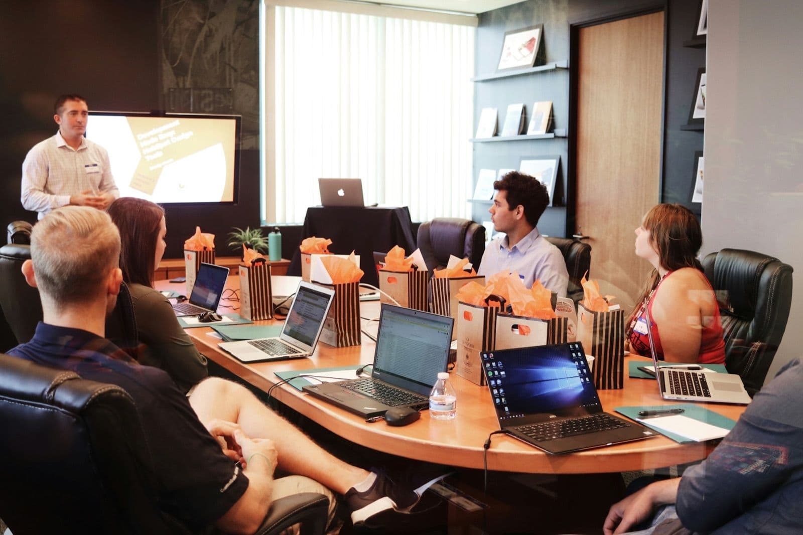 Sourcing team reviewing a reverse auction strategy