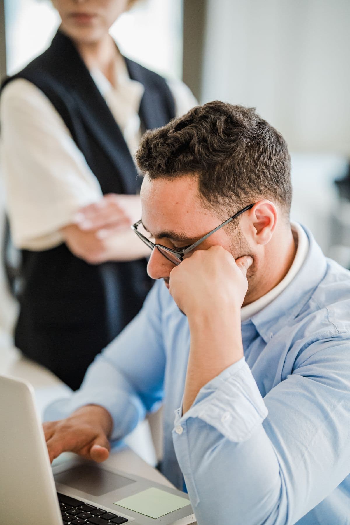 Buyer reviewing information on a laptop in an office